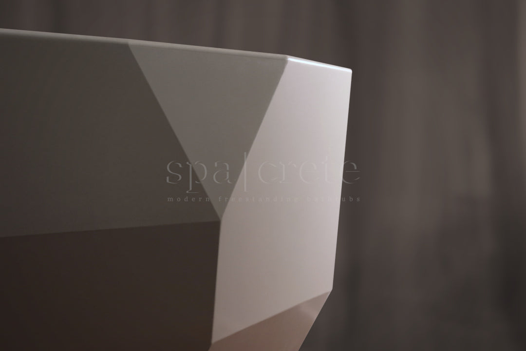 
                    
                     Close-up of smooth exterior finish on SpaCrete Geometric concrete bathtub in titanium white
                    
                  
